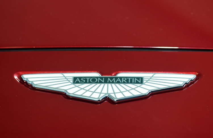 Aston Martin logo on the new DBX, symbolizing recovery in luxury car sales - Global Banking & Finance Review