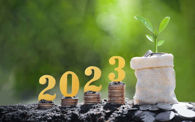 Gold wooden number 2023 on coins representing banking transformation - Global Banking & Finance Review