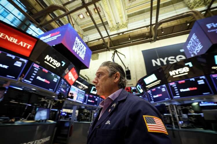 Traders on the NYSE monitor stock prices amid rising global equities - Global Banking & Finance Review
