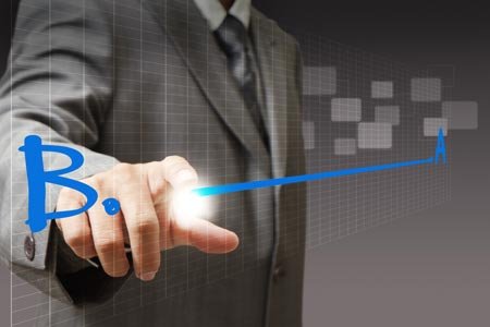 Businessman interacting with digital technology representing banking transition - Global Banking & Finance Review