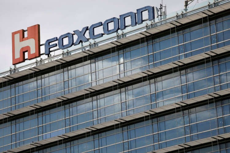 Foxconn logo on building in Taipei, relating to Apple iPhone production issues - Global Banking & Finance Review