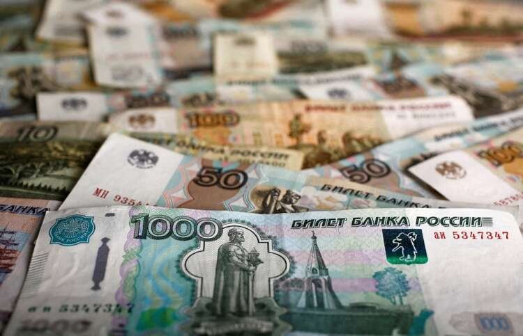 Image of Russian rouble banknotes illustrating currency stability amid economic pressures - Global Banking & Finance Review