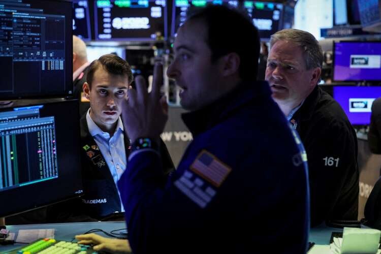 Traders on the NYSE floor reacting to stocks rising and Treasury yields falling - Global Banking & Finance Review