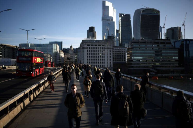 People commuting across London Bridge during busy morning rush hour - Business insolvency in England and Wales - Global Banking & Finance Review