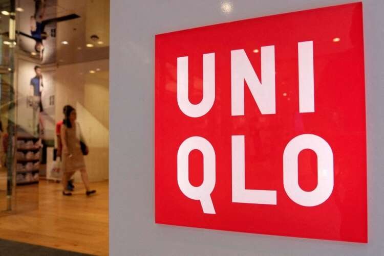 FILE PHOTO: FILE PHOTO: Shoppers walk inside Fast Retailing’s Uniqlo casual clothing store in Tokyo