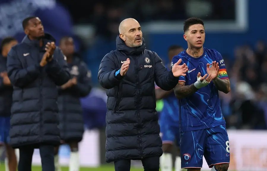 Chelsea players celebrating a goal during a Premier League match - Global Banking & Finance Review