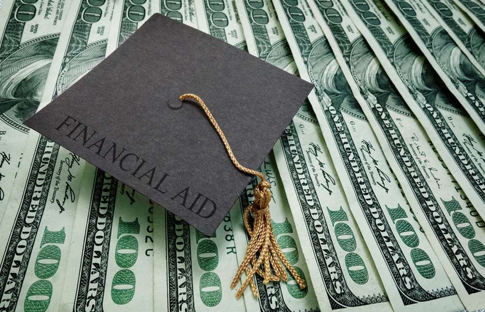 Student reviewing financial aid options for higher education - Global Banking & Finance Review