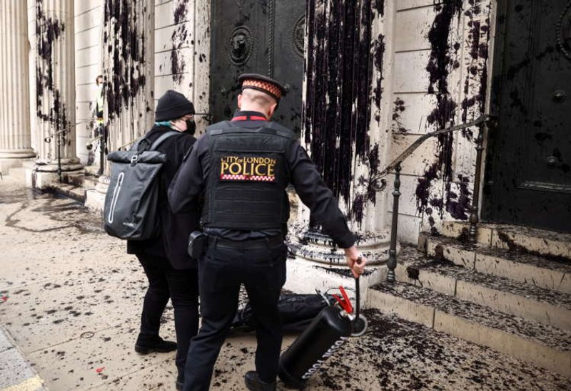 Image for Climate activists splash black dye on Bank of England