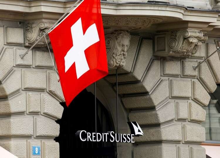 Credit Suisse logo in Zurich with national flag, reflecting bond market concerns - Global Banking & Finance Review