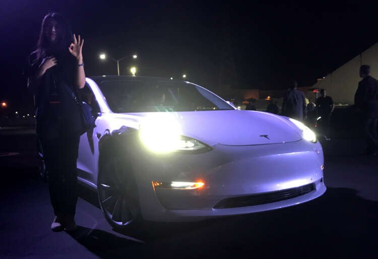Customer employees receive some of the first Model 3 cars off the Fremont factory’s production line during an event at the company’s facilities in Fremont