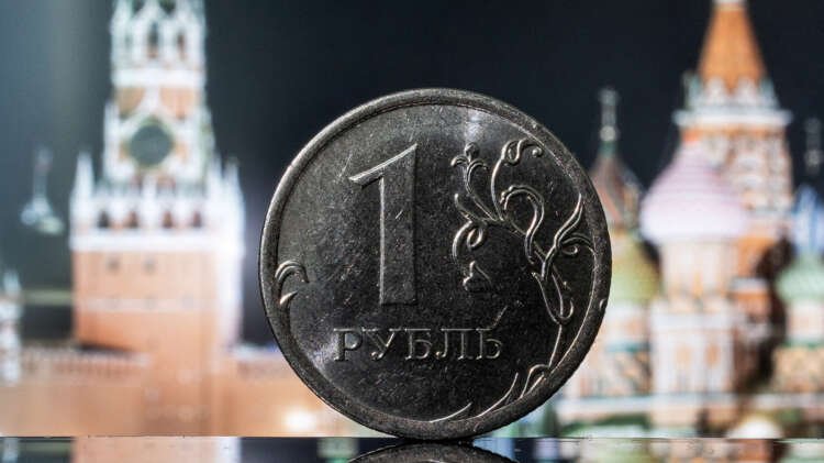 A rouble coin with a digital display of the Kremlin tower, symbolizing Russian currency stability - Global Banking & Finance Review