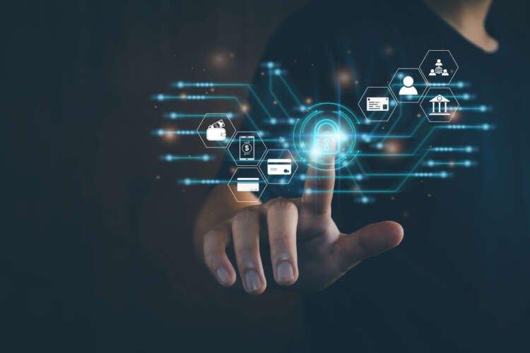 Businessman interacting with a digital lock symbolizing identity and access management in banking - Global Banking & Finance Review