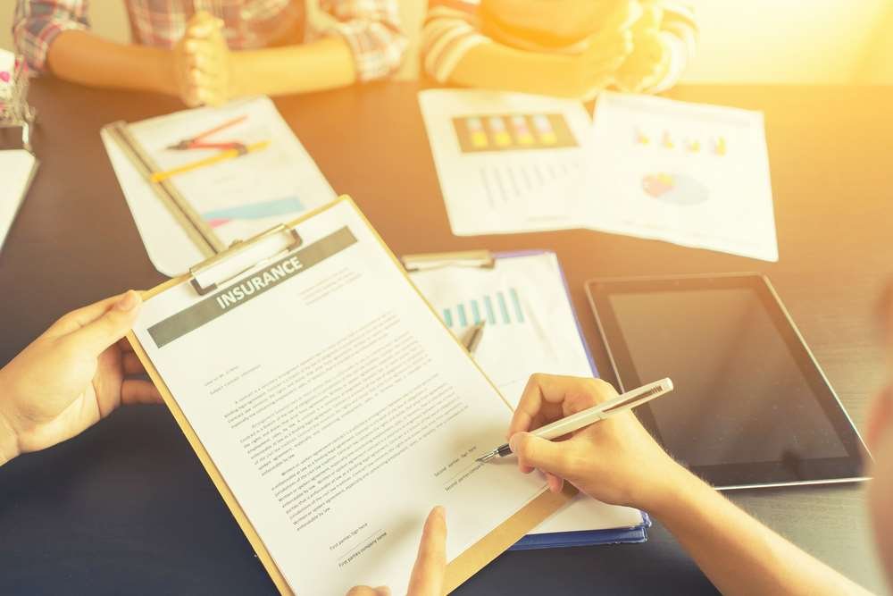 A tech-savvy policyholder interacting with an insurer through smart home technology - Global Banking & Finance Review