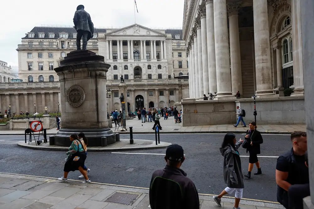 Protesters outside the Bank of England discussing liquidity measures - Global Banking & Finance Review