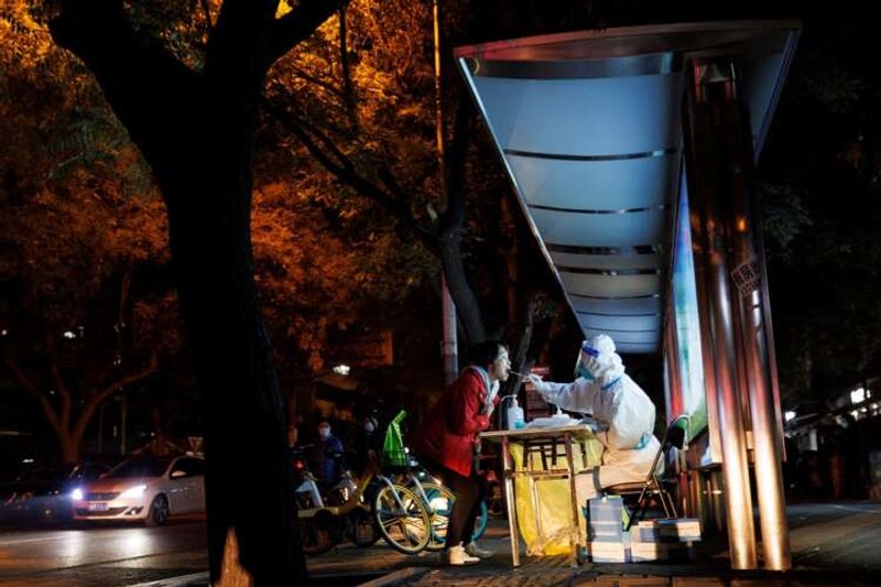 Image for New China COVID rules spur concern as some cities halt routine tests