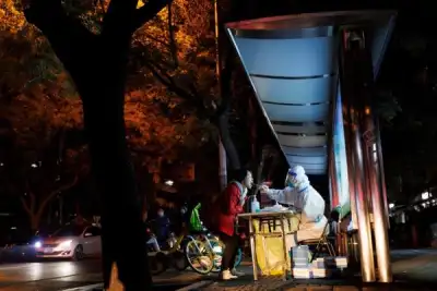 Image for New China COVID rules spur concern as some cities halt routine tests