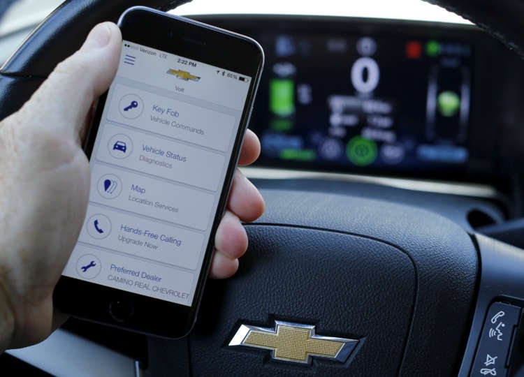 CEO Mary Barra bets GM can grow beyond cars and trucksFILE PHOTO: A mobile phone displays the OnStar app inside a Chevrolet Volt vehicle in this photo illustration taken in Encinitas