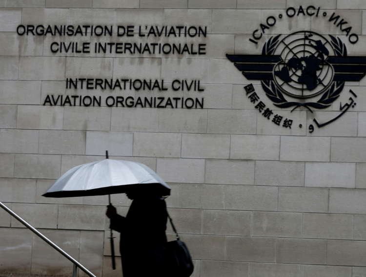 FILE PHOTO: A pedestrian walks past the International Civil Aviation Organization (ICAO) headquarters building in Montreal