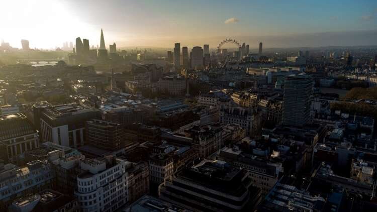 View of London skyline with the Shard and London Eye amidst discussions on coal-fired power plants - Global Banking & Finance Review