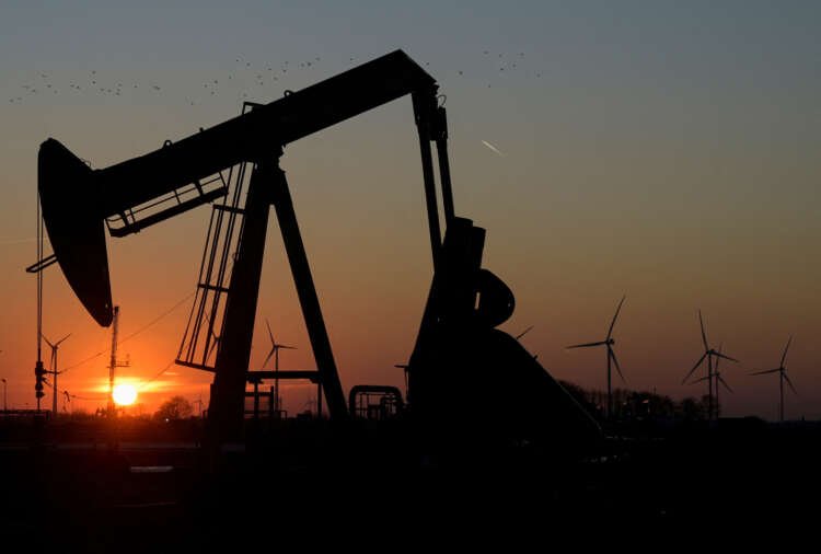 Oil pumps operating in a field, highlighting rising oil prices amid banking crisis fears - Global Banking & Finance Review