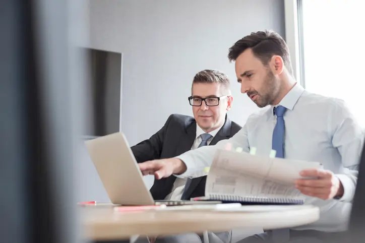 Business professionals consulting with a legal advisor for lawsuit protection - Global Banking & Finance Review