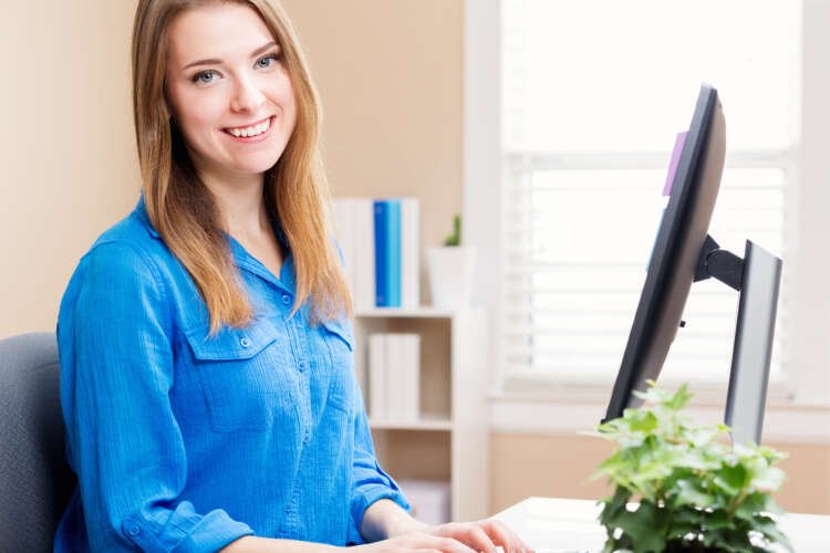 Young woman working in her home office, embodying flexible working post-COVID-19 - Global Banking & Finance Review