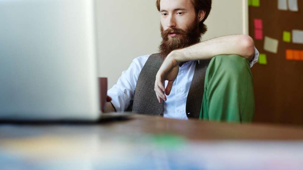 Business professionals discussing cybersecurity risks of remote work - Global Banking & Finance Review