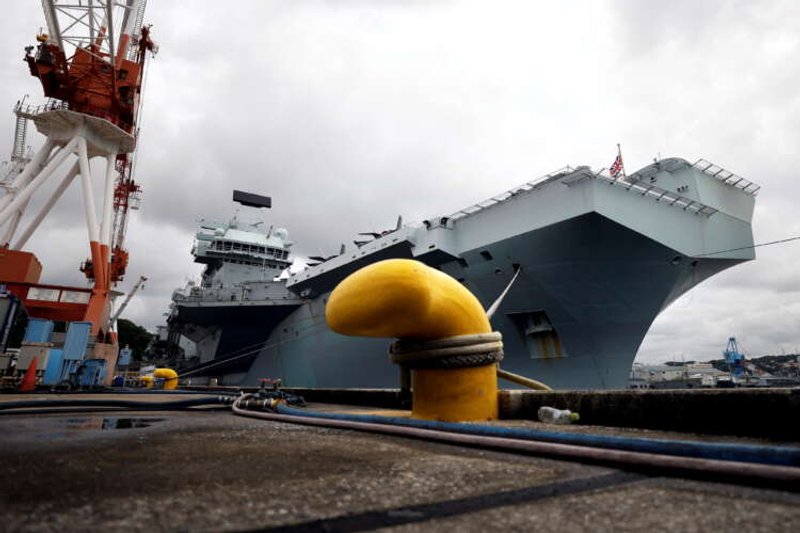 Image for Britain shows off Queen Elizabeth aircraft carrier to anxious Japan