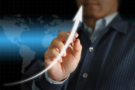 Young stylish businessman representing growth in financial services - Global Banking & Finance Review