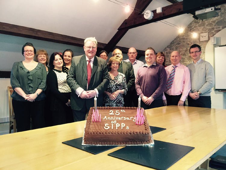 Celebratory cake symbolizing the 25th anniversary of SIPPs in retirement planning - Global Banking & Finance Review