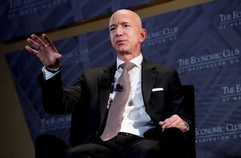 Image for Bezos, Musk top Forbes’ record-setting billionaire list