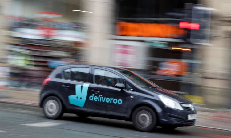 Deliveroo delivery driver in Manchester reflecting on IPO challenges - Global Banking & Finance Review