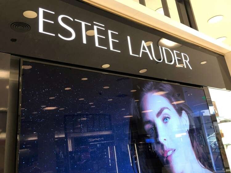Estee Lauder cosmetics counter showcasing beauty products amid inflation trends - Global Banking & Finance Review