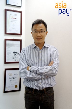 A young professional showcasing e-payment technology innovations - Global Banking & Finance Review