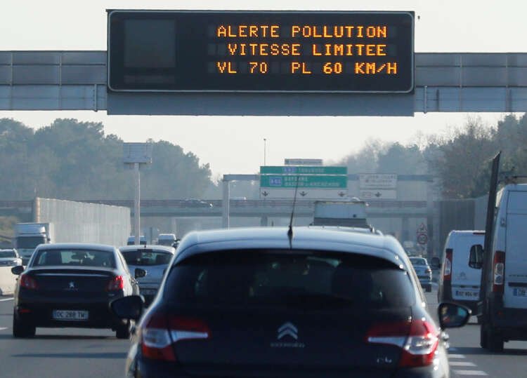 Electronic road sign indicating pollution and speed limit for cars - Global Banking & Finance Review