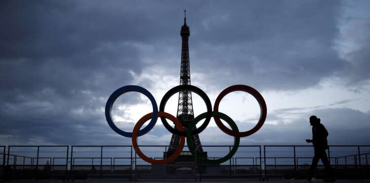 Eiffel Tower with Olympic rings, symbolizing Paris 2024 Olympic flame hopes - Global Banking & Finance Review