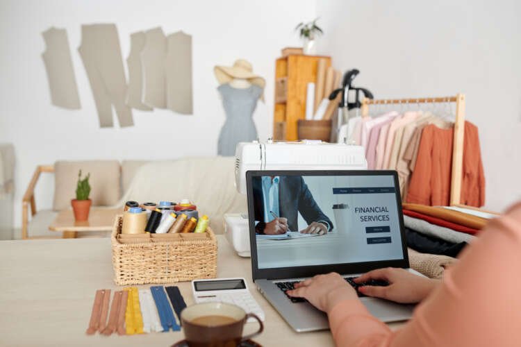 Business owner navigating online banking solutions amid rising interest rates - Global Banking & Finance Review