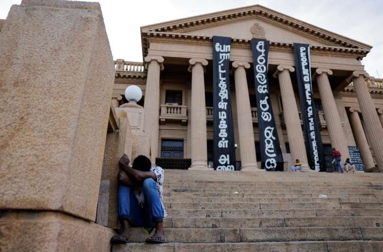 Demonstrator sleeping at the Presidential Secretariat during Sri Lanka's political crisis - Global Banking & Finance Review