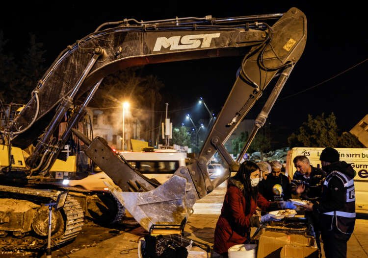 Workers clearing rubble from earthquake destruction in Turkey - Global Banking & Finance Review