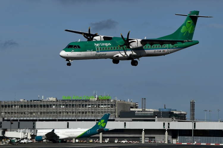 Aer Lingus aircraft at an airport, highlighting financial challenges amid Irish travel plans - Global Banking & Finance Review