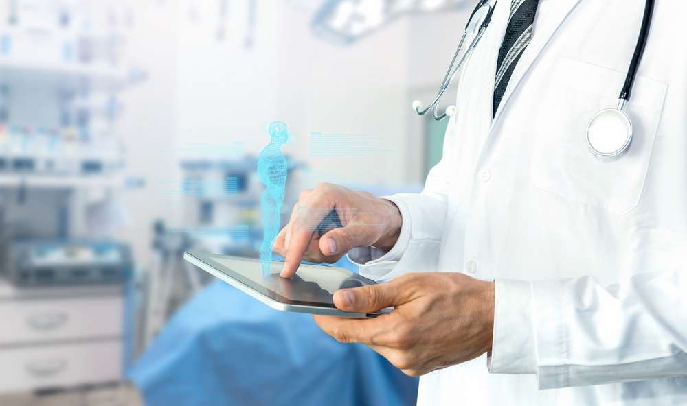 Healthcare professional using mobile technology to enhance patient care - Global Banking & Finance Review