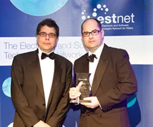 Huw Rees (on the right of the picture) Chief Technology Officer at Vizolution collecting the award.