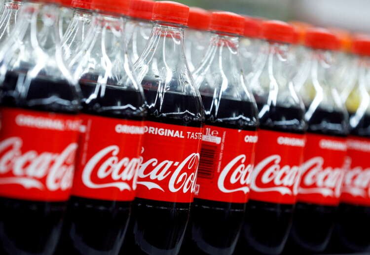 Coca-Cola HBC bottles displayed at a store, reflecting profits amidst Russia-Ukraine crisis - Global Banking & Finance Review