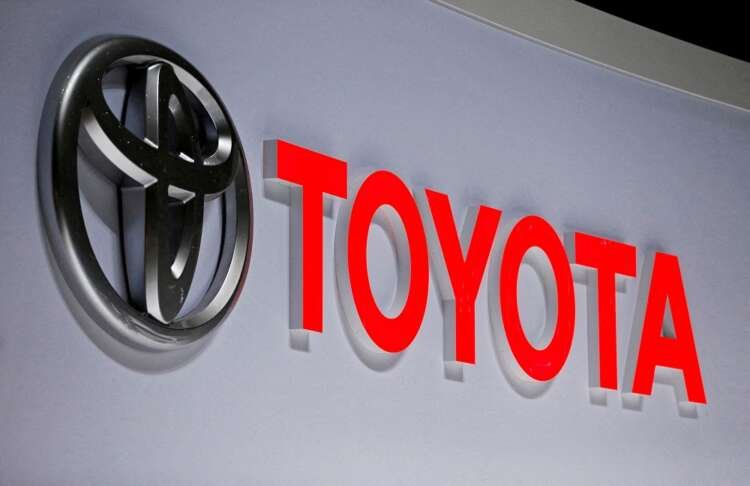 Toyota logo displayed at an auto show, highlighting challenges in semiconductor supply - Global Banking & Finance Review