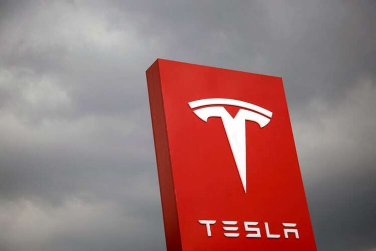 Tesla logo showcasing the electric vehicle brand amid demand concerns - Global Banking & Finance Review
