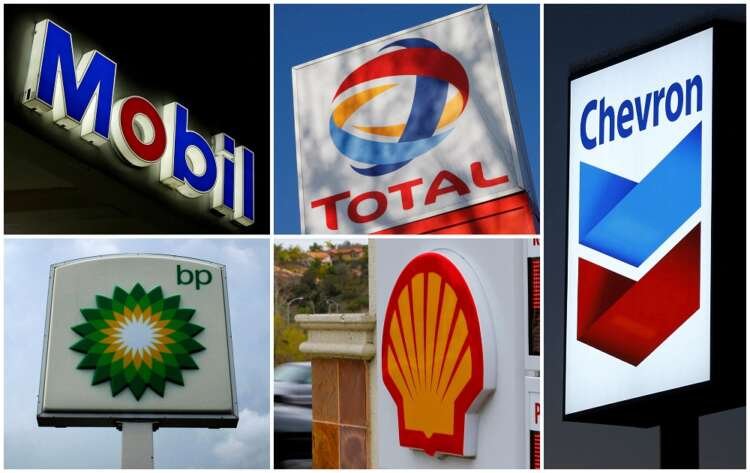 Logos of major oil companies Exxon and Chevron, highlighting their record earnings - Global Banking & Finance Review