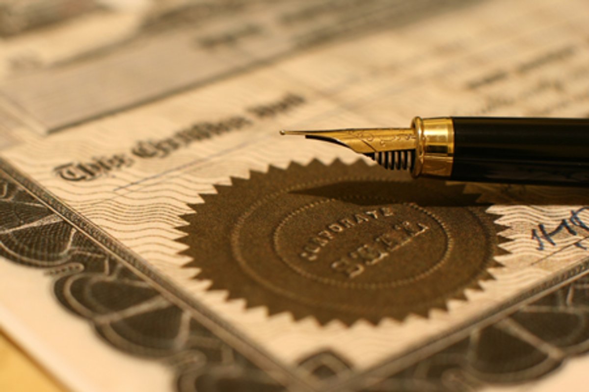 Elegant fountain pen resting on corporate documents, representing investment insights - Global Banking & Finance Review