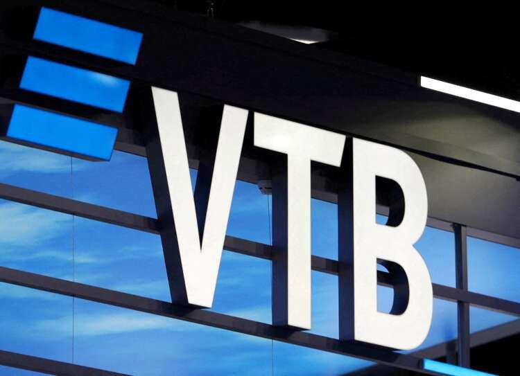 VTB bank logo displayed at an economic forum, linked to Russian shares trading - Global Banking & Finance Review