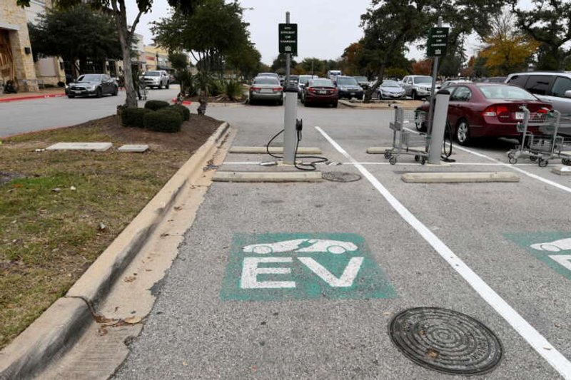 Image for Biden’s EV charging push boosts established automakers taking on Tesla