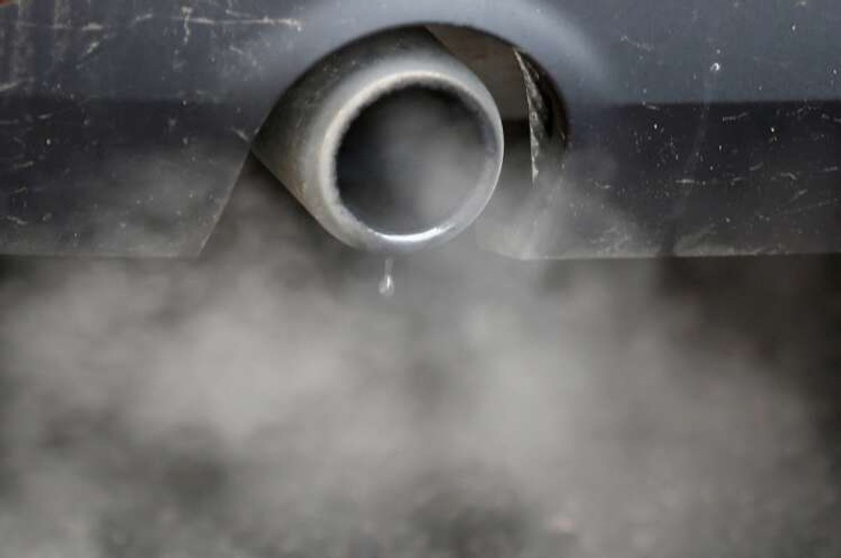 FILE PHOTO: An exhaust emits fumes as a car is driven through Richmond in London
